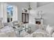 Well-appointed living area with cozy seating, a fireplace, and tasteful decor at 721 Hardwood Cir, Orlando, FL 32828