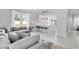 Open-concept living space connecting to a modern kitchen with a center island at 721 Hardwood Cir, Orlando, FL 32828