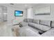 Comfortable living room with a large sectional sofa, TV, and stylish decor at 721 Hardwood Cir, Orlando, FL 32828