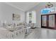 Bright living room with an open floor plan, elegant decor, and plenty of natural light at 721 Hardwood Cir, Orlando, FL 32828