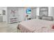 Airy bedroom featuring a decorative vanity with makeup station, and streaming sunlight at 721 Hardwood Cir, Orlando, FL 32828