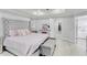 Spacious main bedroom showcasing a luxurious bed, tray ceiling, and a seamless transition to the en-suite bath at 721 Hardwood Cir, Orlando, FL 32828