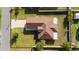 Overhead view of home showcasing roof, yard, and lot with adjacent street at 802 Massy Ct, Kissimmee, FL 34759