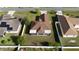 Aerial view of the home showing surrounding homes, roofs and fenced backyard at 802 Massy Ct, Kissimmee, FL 34759