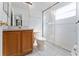 Bathroom featuring a vanity, toilet and glass shower with white tile surround at 802 Massy Ct, Kissimmee, FL 34759