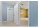 Entryway featuring tile floors, blue accent wall, front door, and open doorway to another room at 802 Massy Ct, Kissimmee, FL 34759