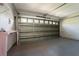 Spacious garage with block walls and a large door with windows offering ample storage and parking at 802 Massy Ct, Kissimmee, FL 34759