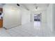 Bright, open living room with tile floors, ceiling fan, and sliding glass door at 802 Massy Ct, Kissimmee, FL 34759