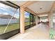 Screened patio features access to the backyard and glass doors to let in sunlight at 802 Massy Ct, Kissimmee, FL 34759
