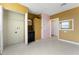 Bonus room with yellow and pink accents featuring a vanity and access to other rooms at 802 Massy Ct, Kissimmee, FL 34759