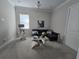 Cozy living room with a comfortable sectional sofa, side tables, and soft carpeting at 8270 Topsail Pl, Winter Garden, FL 34787