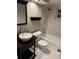 Bathroom with sink, mirror, toilet, and shower/tub combination at 878 Elgin Dr, Winter Springs, FL 32708