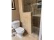 Bathroom with toilet, walk-in shower, and tile walls and floor at 878 Elgin Dr, Winter Springs, FL 32708
