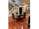 Elegant dining room featuring wood floors, modern lighting, and classic decor at 878 Elgin Dr, Winter Springs, FL 32708