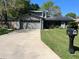 Charming home featuring a two-car garage, solar panels, and well-maintained landscaping at 878 Elgin Dr, Winter Springs, FL 32708