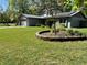 Charming home featuring a two-car garage, solar panels, and well-maintained landscaping at 878 Elgin Dr, Winter Springs, FL 32708