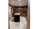Modern kitchen with stainless steel appliances, granite countertops, and a center island at 878 Elgin Dr, Winter Springs, FL 32708