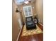 Cozy room with a lounge chair, floor lamp, side table and wood floors at 878 Elgin Dr, Winter Springs, FL 32708