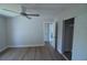 Neutral bedroom with wood floors, large closet, updated fan and large closet at 894 Superior St, Deltona, FL 32725