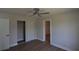 Neutral bedroom with wood floors, large closet and updated fan at 894 Superior St, Deltona, FL 32725
