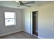 Neutral bedroom with wood floors, large closet and updated fan at 894 Superior St, Deltona, FL 32725
