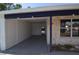 Open carport showcasing stone accents, neutral colors and access to backyard pool at 894 Superior St, Deltona, FL 32725