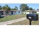 Well-kept home exterior with stone accents, front palm tree, and a neatly manicured lawn at 894 Superior St, Deltona, FL 32725