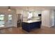 Kitchen with stainless steel appliances, a blue island, and an open concept design at 894 Superior St, Deltona, FL 32725