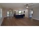 Open living area and kitchen with stainless steel appliances and hardwood floors at 894 Superior St, Deltona, FL 32725