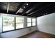 Bright living room features hardwood floors, track lighting, and large windows at 894 Superior St, Deltona, FL 32725