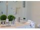 Modern main bathroom vanity with granite countertops, decor, and large mirror at 926 Balmoral Dr, Davenport, FL 33896