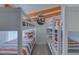bedroom with built in bunk beds with striped bedding and decor at 926 Balmoral Dr, Davenport, FL 33896