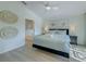 Modern bedroom featuring artwork, neutral colors, and ensuite bath at 926 Balmoral Dr, Davenport, FL 33896