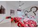 View of a bright bedroom with whimsical decor and two twin beds at 926 Balmoral Dr, Davenport, FL 33896