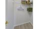 Organized closet with wood floors, shelves and hanging racks at 926 Balmoral Dr, Davenport, FL 33896