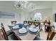 Open concept dining room with seating for eight and a view into the living room at 926 Balmoral Dr, Davenport, FL 33896
