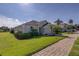 Beautiful home featuring lush green lawn and an inviting, neatly brick-paved driveway at 926 Balmoral Dr, Davenport, FL 33896