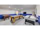 Spacious game room with pool table, air hockey, foosball table, and ample space for entertainment at 926 Balmoral Dr, Davenport, FL 33896