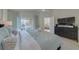 Beautiful main bedroom with light wood floors, ceiling fan, and sliding glass doors to the outside patio at 926 Balmoral Dr, Davenport, FL 33896