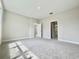 This bedroom boasts neutral paint, carpet, and access to the ensuite bathroom and closet at 1001 Umbria Dr, Poinciana, FL 34759