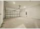 Spacious two-car garage with ample room for parking and storage, equipped with an automatic door opener at 1001 Umbria Dr, Poinciana, FL 34759