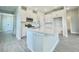 Beautiful kitchen featuring a center island, modern appliances, and white cabinets at 1001 Umbria Dr, Poinciana, FL 34759