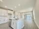 Open-concept kitchen featuring a large island, modern appliances, and plenty of counter space at 1001 Umbria Dr, Poinciana, FL 34759