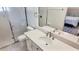 Clean bathroom with extended white vanity, a shower stall, and toilet at 10237 Sw 63Rd Ave, Ocala, FL 34476