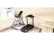 This exercise room has an inversion table and a treadmill for working out at home at 10237 Sw 63Rd Ave, Ocala, FL 34476