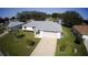 Aerial view of a well-maintained one-story home with a gray roof and green lawn at 10237 Sw 63Rd Ave, Ocala, FL 34476