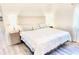 This is the main bedroom with a king bed and bedside tables with lamps, ready for relaxation at 10237 Sw 63Rd Ave, Ocala, FL 34476