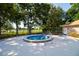 Enjoy this inviting jacuzzi pool surrounded by lush landscaping for relaxation and recreation at 10237 Sw 63Rd Ave, Ocala, FL 34476