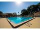 Large community pool with clear blue water, surrounded by plenty of space to relax and enjoy the sun at 10237 Sw 63Rd Ave, Ocala, FL 34476