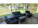 Cozy screened porch with comfortable seating offers a relaxing space to enjoy the outdoors at 10237 Sw 63Rd Ave, Ocala, FL 34476